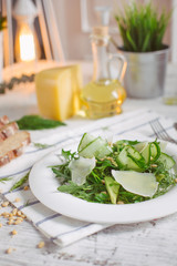 vegetarian Green salad with Parmesan arugula avocado nuts