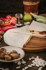 Nice vegetarian quesadilla with tortilla bread, beans, cheese and vegetables.