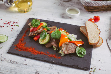 Beef tongue grilled with herbs and vegetables
