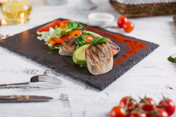 Beef tongue grilled with herbs and vegetables
