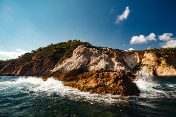 View of the coastal cliff with gulls from the open sea