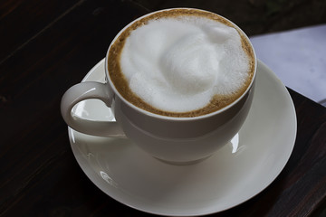 Hot coffee in a white cup
