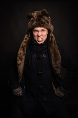 The man in the jacket on a dark background