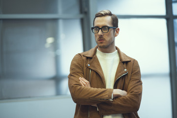 businessman in jacket and glasses in the business center