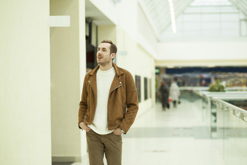 Fototapeta premium young guy walks through the Mall
