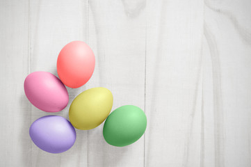 Vintage colorful easter eggs on white wood table background with clipping path of the eggs