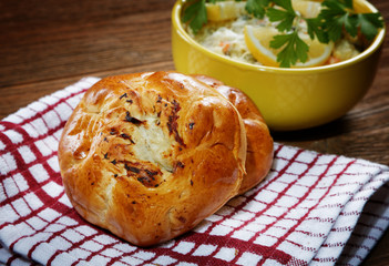 plate with salad and bread rolls at the village table