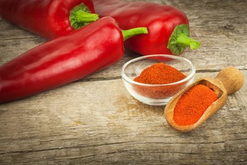 Dried red pepper. Traditional spices. Kitchen table with dried and fresh pepper. Seasoning food.