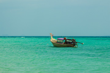 Naklejka na ściany i meble Traditional thai longtail boat near Poda island (Koh Poda) beach in Andaman sea, Krabi province, Thailand