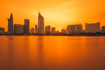 Fototapeta na wymiar Ho Chi Minh city, Vietnam - March 06, 201: Colorful sunset on Sai Gon river