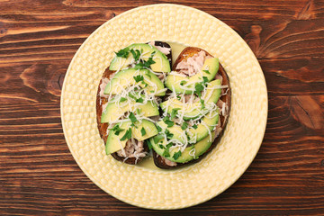 Open avocado sandwiches with tuna on whole grain bread