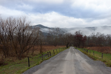 Fototapeta na wymiar Mountain Range in Fog and Clouds