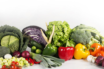 Young spring vegetables on black wood. Background with place for text