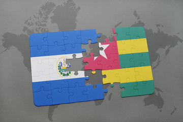 puzzle with the national flag of el salvador and kuwait on a world map
