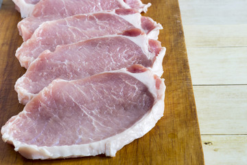 Raw meat on wood board