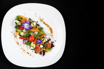 Greek salad fresh vegetables with feta cheese and grated black olives.