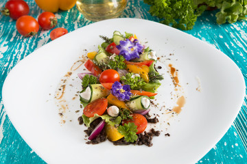 Greek salad fresh vegetables with feta cheese and grated black olives.