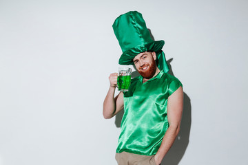 Smiling bearded man in green costume