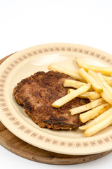 Burger with french fries served on the plate. Minced meat hamburger with potatoes isolated over white background