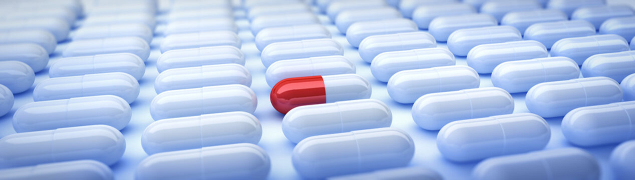Rotwei&szlig;e Tablette in Gruppe wei&szlig;er Tabletten