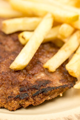 Closeup macro minced meat burger with french fries