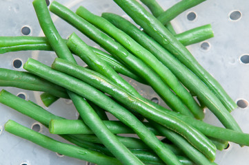 Fresh green beans draining after cooking