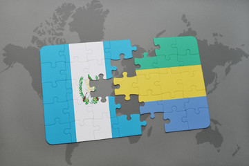 puzzle with the national flag of guatemala and gabon on a world map