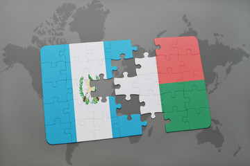 puzzle with the national flag of guatemala and madagascar on a world map