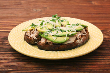 Open avocado sandwiches with tuna on whole grain bread