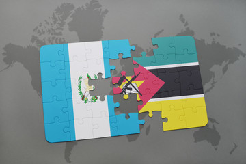 puzzle with the national flag of guatemala and mozambique on a world map