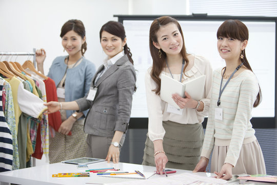 Four businesswomen smiling
