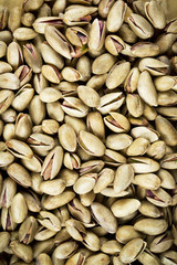 Pistachio nuts for healthy eating. Natural vertical background