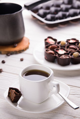 Coffee with assortment of chocolate candies