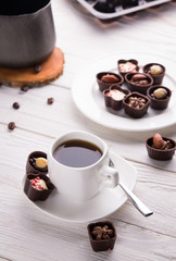 Coffee with assortment of chocolate candies