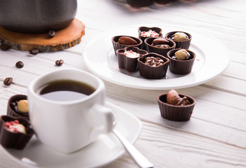 Coffee with assortment of chocolate candies