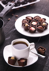 Coffee with assortment of chocolate candies