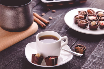 Coffee with assortment of chocolate candies