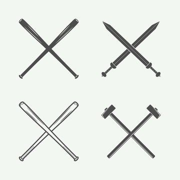 Set of vintage cross weapons in retro style. Bats, swords, hammers. Vector illustration. Monochrome Graphic Art.