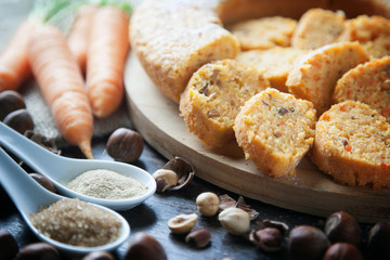 Vegan carrot cake detail with brown sugar, ginger and nuts.
