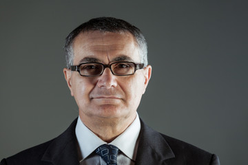Attractive middle-aged businessman in glasses