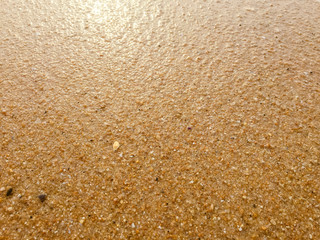 Abstract natural sandy beach closeup, seacoast background. Space surface for text