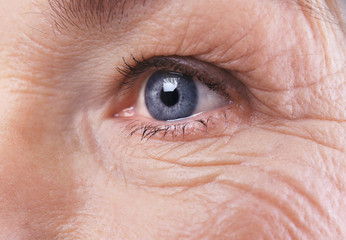 Senior woman face with wrinkles, closeup