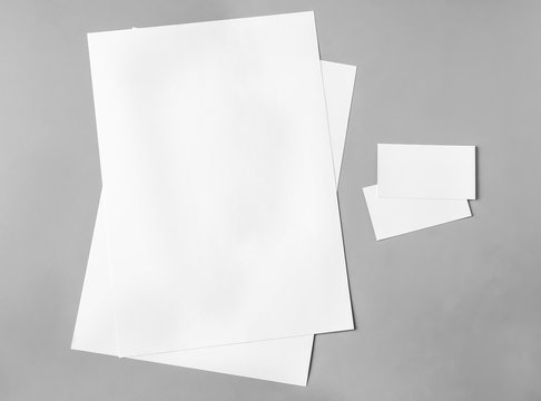 Blank brochure and business cards on grey background