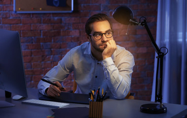 Modern designer working in office