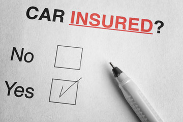 Car insurance concept. Pen on question form