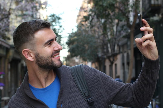 Man taking a selfie in the city 