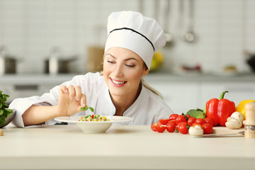 Female chef preparing in kitchen