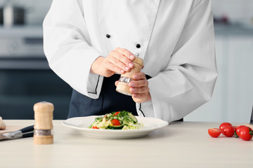 Female chef hands preparing in kitchen