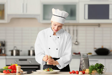 Female chef preparing in kitchen