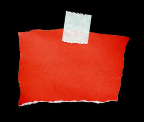 pieces of torn and hole paper on black. copy space